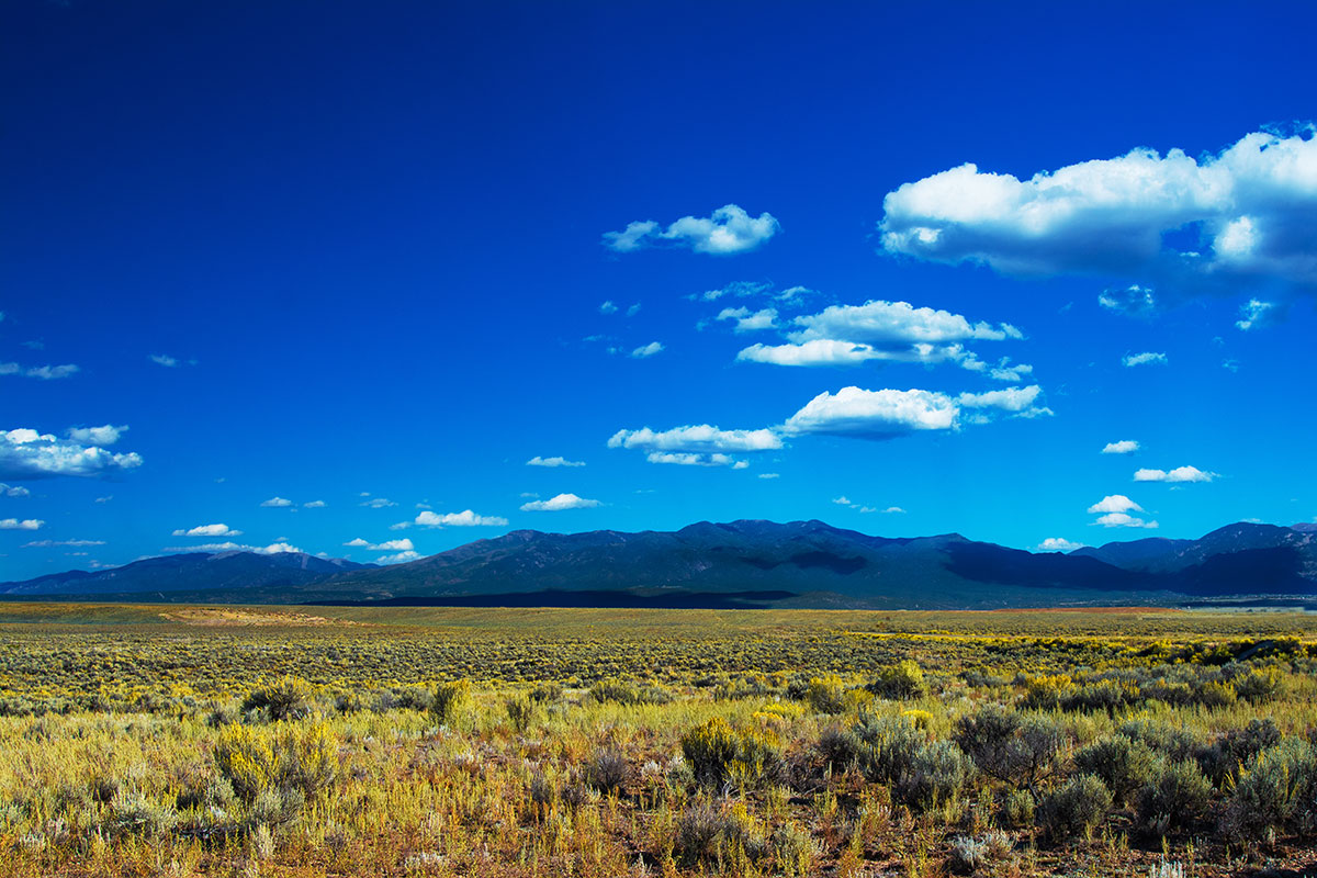 image of desert and mountains outside of Taos, New Mexico