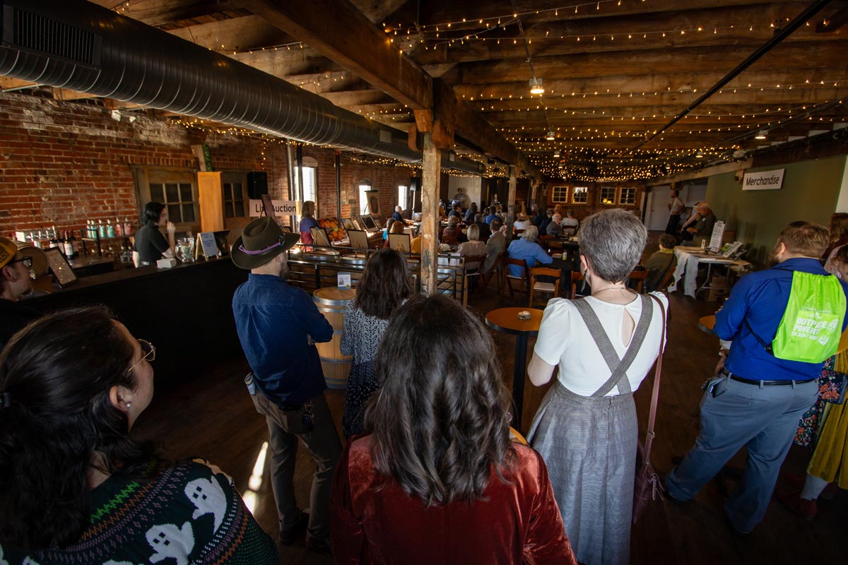 dozens of people in a hayloft