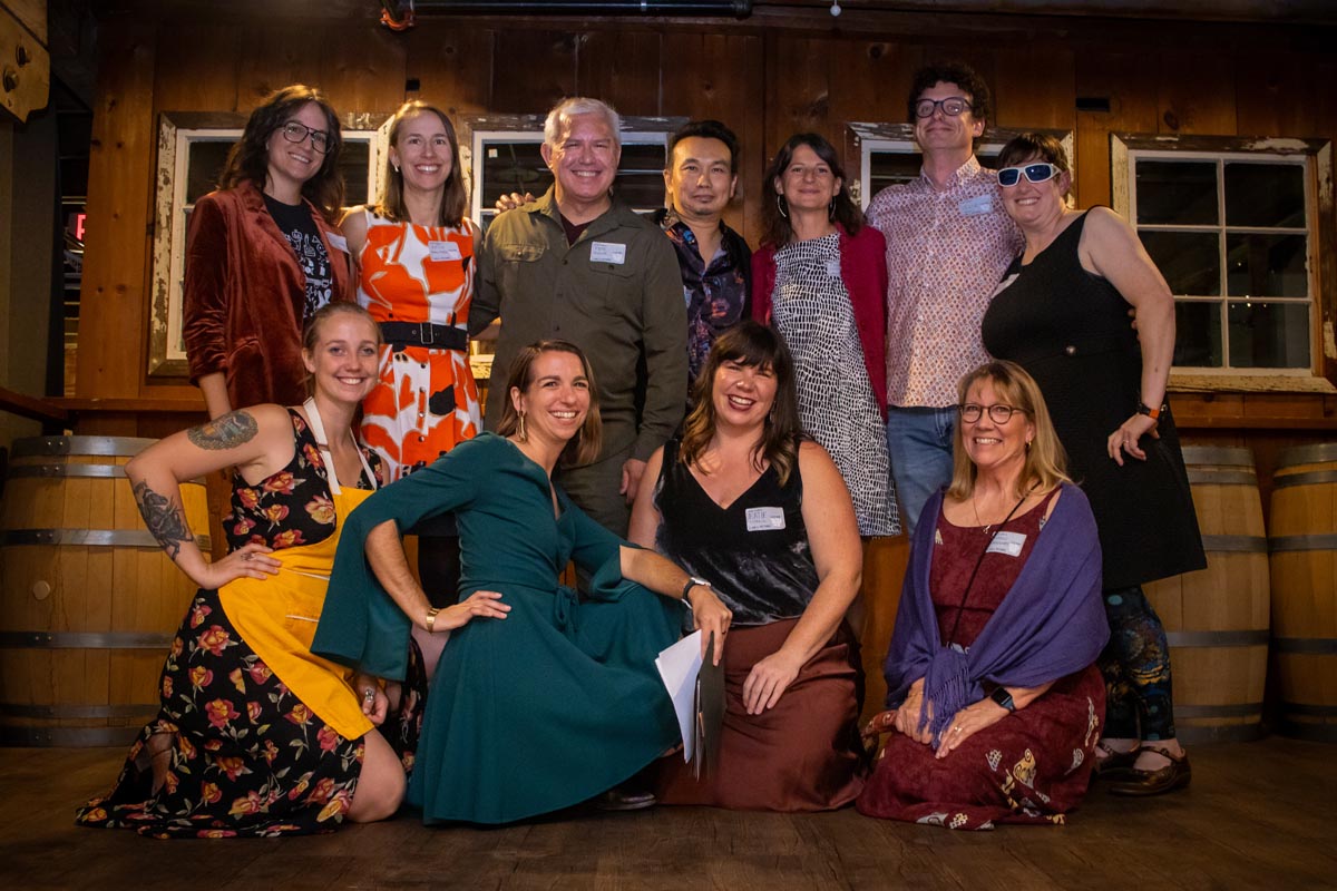 group of people dressed up smiling