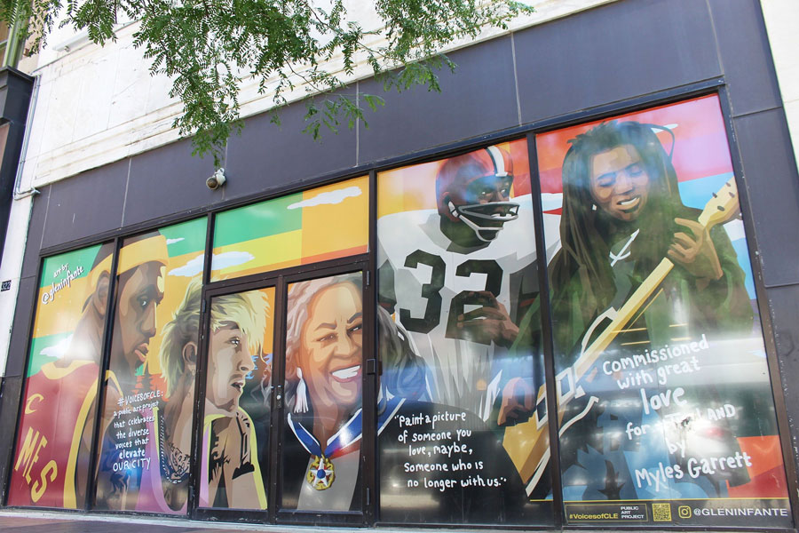 colorful mural of five people on a businessfront