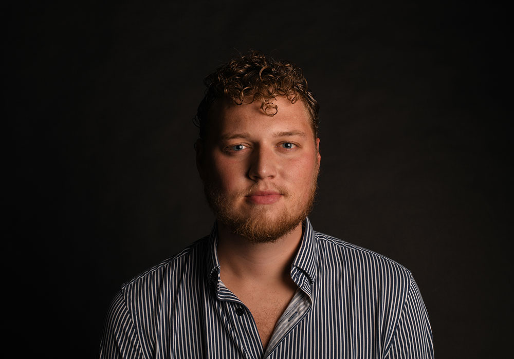 portrait of a man against a dark background