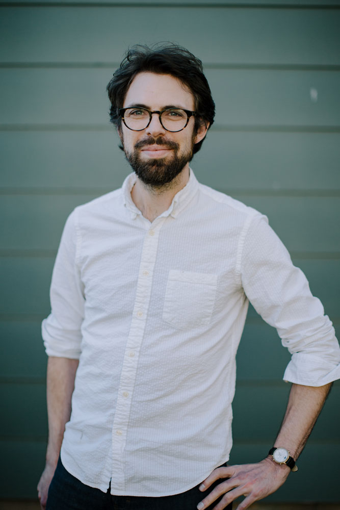 portrait of a man in front of a wall