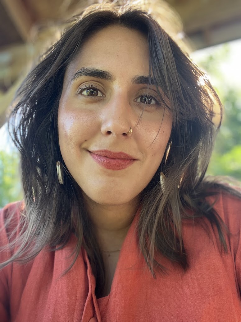 woman smiling with light in the background